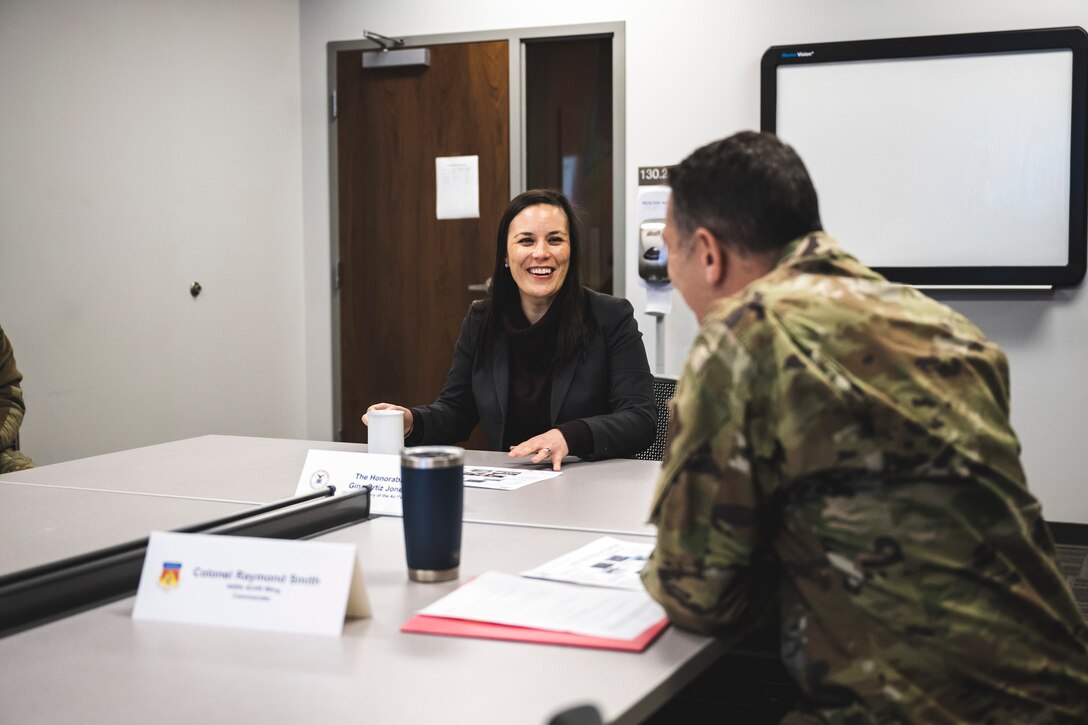 Gina Ortiz Jones, undersecretary of the Air Force, receives a briefing Jan. 9 from Col. Ray Smith, 445th Airlift Wing commander, during her tour of Wright-Patterson Air Force Base, Ohio. It marked one of eight stops during her visit.