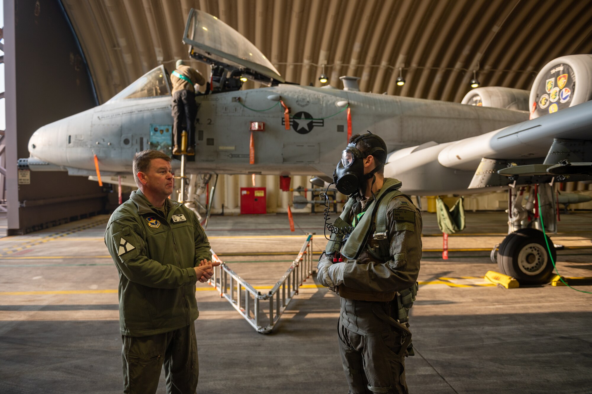 U.S. Air Force Col. Daniel Roberts, 97th Medical Group commander, Altus Air Force Base, Oklahoma, runs through step, launch and recovery (SLR) tactics, techniques and procedures with U.S. Air Force 1st Lt. Michael Davey, 25th Fighter Squadron A-10C Thunderbolt II pilot, during a next generation aircrew protection (NGAP) evaluation at Osan Air Base, Republic of Korea, Jan. 18, 2023.