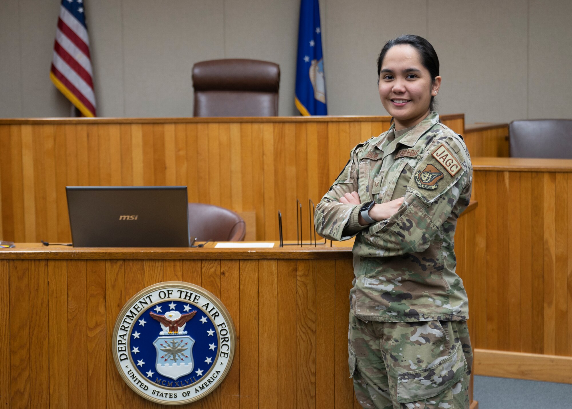 Airman stands in court room