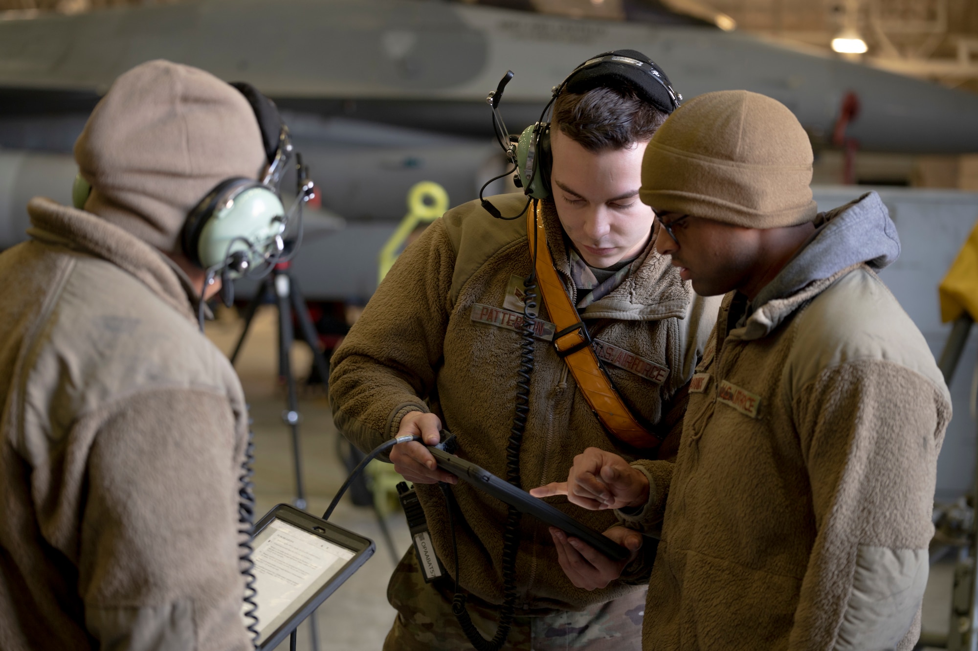 U.S. Air Force Airmen assigned to the 25th Fighter Generation Squadron read over a phase inspection checklist at Osan Air Base, Republic of Korea, Jan. 12, 2023.