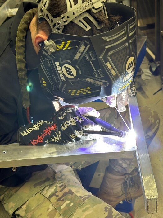 Staff Sgt. Keith Lee, an aircraft metals technology craftsman welds together a ramp, made to specifications to install a Global Aircrew Strategic Network Terminal at the 108th Wing Command Post, Joint Base McGuire-Dix-Lakehurst, N.J. The Air National Guardsman designed and built the custom ramp, saving his unit thousands of dollars. (U.S. Air Force photo by Master Sgt. Leon Jackson)