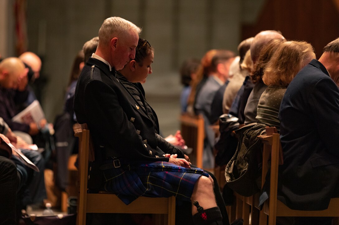 On Veterans Day 2022, the Marine Chamber Orchestra performed a concert with the Washington National Cathedral Choir honoring those who have served the country. Members of the audience sit with heads bowed in prayer.

(U.S. Marine Corps photos by Staff Sgt. Chase Baran/released)