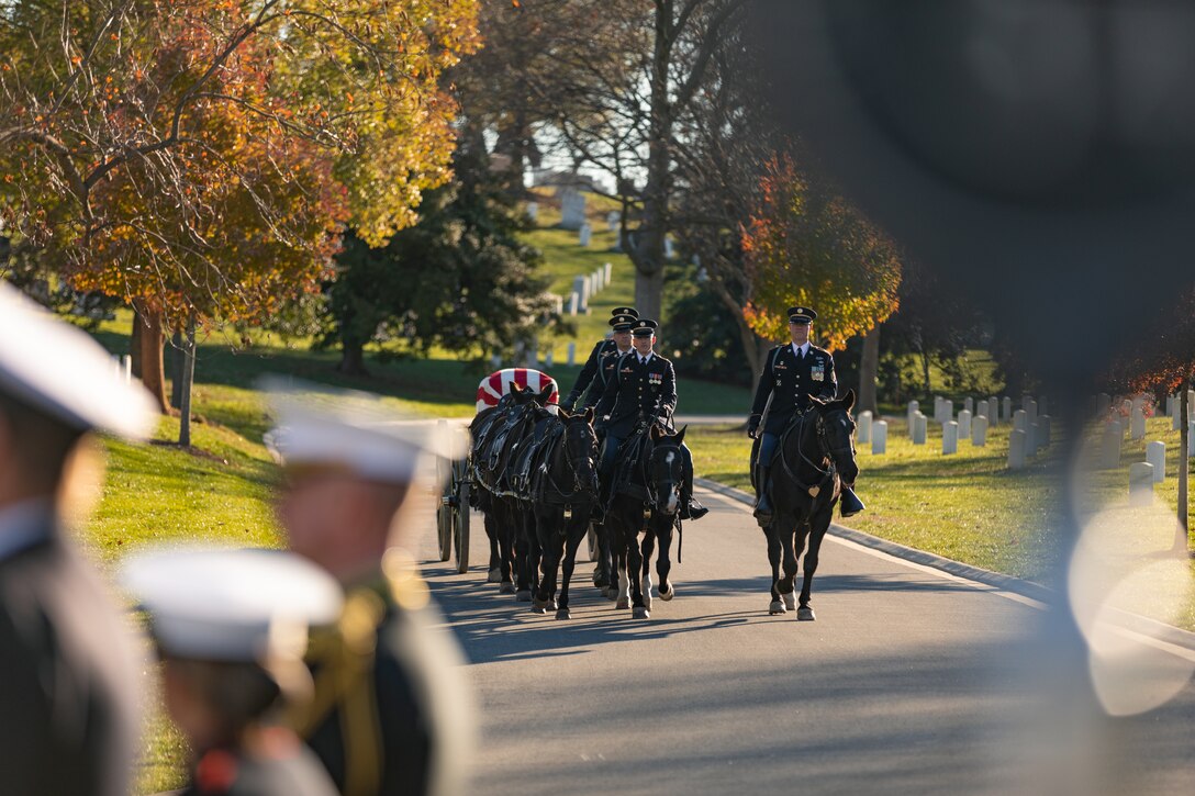 A horse-drawn caisson arrives at the funeral ceremony for Marine Band Oboist Jim Dickey in Arlington National Cemetery.

On Nov. 22, 2022, the United States Marine Band said a final farewell to one of its own in a funeral ceremony at Arlington National Cemetery. Oboist James "Jim" Dickey served in "The President's Own" from 1977 to 2005. He was a frequently featured soloist and served as a tour coordinator with the band. In addition to band support of the funeral, many band members and friends came out in honor of Jim and in support of his family.
.
(U.S. Marine Corps photos by Staff Sgt. Chase Baran/ Released)