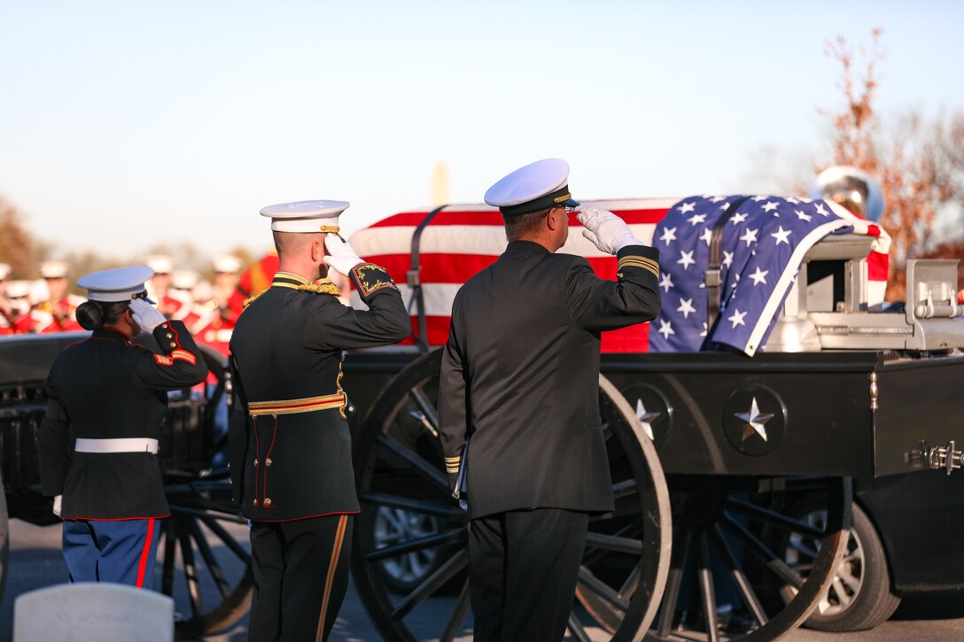 Marine Band Director Col. Jason K. Fettig (center) salutes as the remains of former Marine Band Oboist Jim Dickey are transferred in to the caisson during a funeral ceremony held at Arlington National Cemetery.

On Nov. 22, 2022, the United States Marine Band said a final farewell to one of its own in a funeral ceremony at Arlington National Cemetery. Oboist James "Jim" Dickey served in "The President's Own" from 1977 to 2005. He was a frequently featured soloist and served as a tour coordinator with the band. In addition to band support of the funeral, many band members and friends came out in honor of Jim and in support of his family.
.
(U.S. Marine Corps photos by Staff Sgt. Chase Baran/ Released)