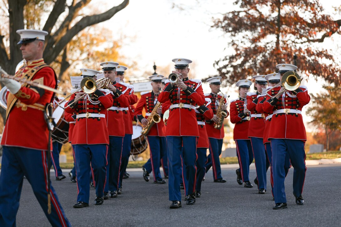 The Marine Band marches through Arlington National Cemetery during the funeral ceremony for former Marine Band Oboist Jim Dickey.

On Nov. 22, 2022, the United States Marine Band said a final farewell to one of its own in a funeral ceremony at Arlington National Cemetery. Oboist James "Jim" Dickey served in "The President's Own" from 1977 to 2005. He was a frequently featured soloist and served as a tour coordinator with the band. In addition to band support of the funeral, many band members and friends came out in honor of Jim and in support of his family.
.
(U.S. Marine Corps photos by Staff Sgt. Chase Baran/ Released)
