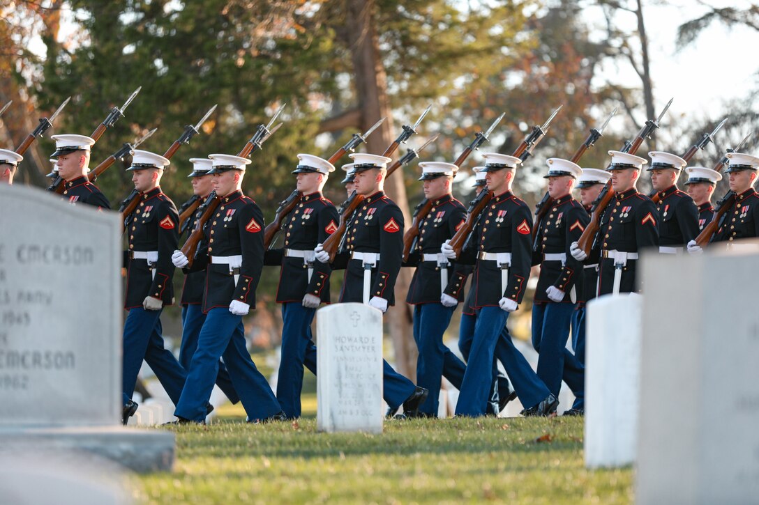 Marines march through Arlington National Cemetery during the funeral ceremony for former Marine Band Oboist Jim Dickey.

On Nov. 22, 2022, the United States Marine Band said a final farewell to one of its own in a funeral ceremony at Arlington National Cemetery. Oboist James "Jim" Dickey served in "The President's Own" from 1977 to 2005. He was a frequently featured soloist and served as a tour coordinator with the band. In addition to band support of the funeral, many band members and friends came out in honor of Jim and in support of his family.
.
(U.S. Marine Corps photos by Staff Sgt. Chase Baran/ Released)