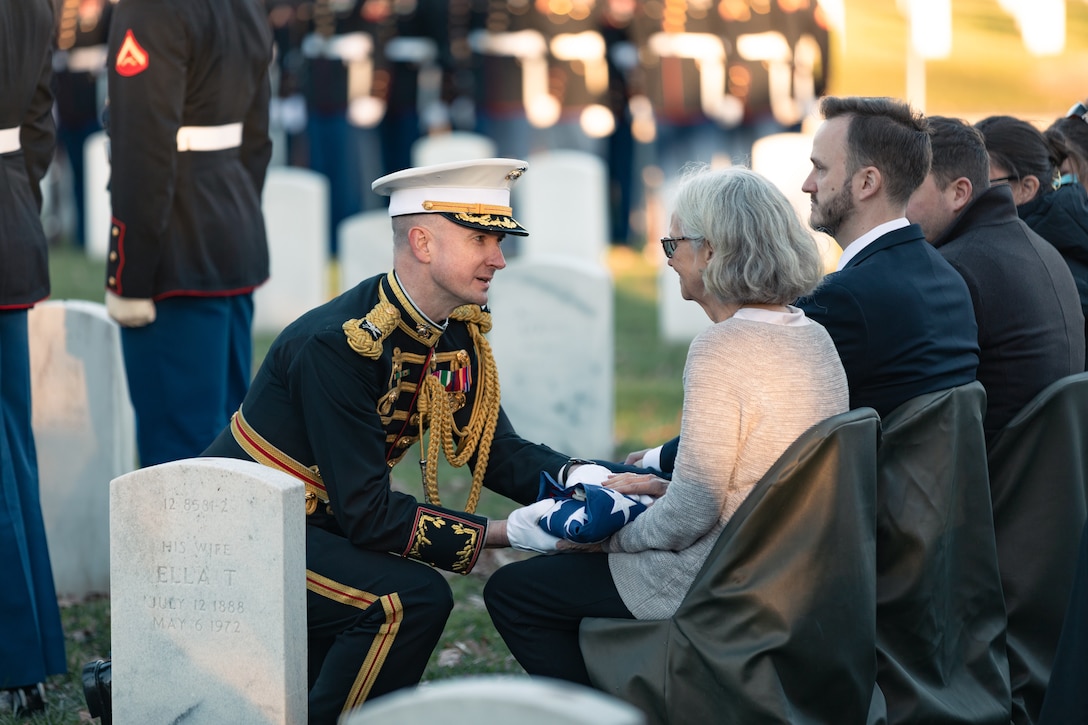 Marine Band Director Col. Jason K. Fettig hands over a flag to the wife of former Marine Band Oboist Jim Dickey  at the musician's funeral ceremony at Arlington National Cemetery.

On Nov. 22, 2022, the United States Marine Band said a final farewell to one of its own in a funeral ceremony at Arlington National Cemetery. Oboist James "Jim" Dickey served in "The President's Own" from 1977 to 2005. He was a frequently featured soloist and served as a tour coordinator with the band. In addition to band support of the funeral, many band members and friends came out in honor of Jim and in support of his family.
.
(U.S. Marine Corps photos by Staff Sgt. Chase Baran/ Released)