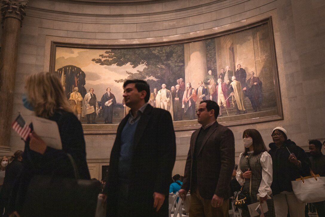 People file into the National Archives rotunda prior to their naturalization at U.S. citizens on Dec. 15, 2022.

(U.S. Marine Corps Photos by Staff Sgt. Chase Baran/released)