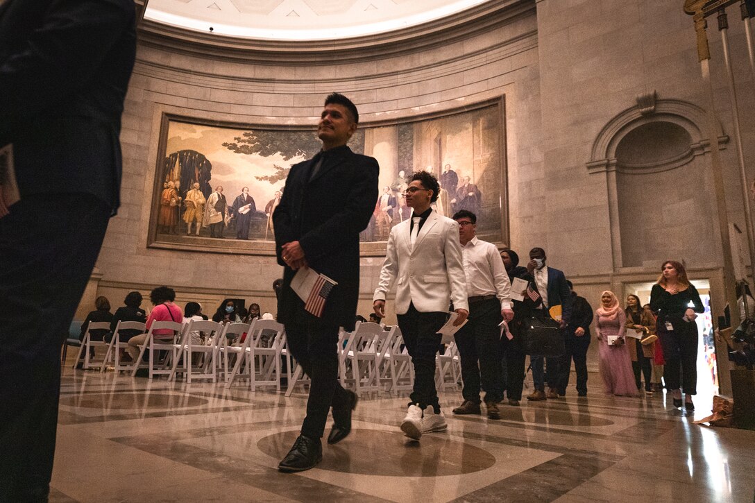 People file into the National Archives rotunda prior to their naturalization at U.S. citizens on Dec. 15, 2022.

(U.S. Marine Corps Photos by Staff Sgt. Chase Baran/released)