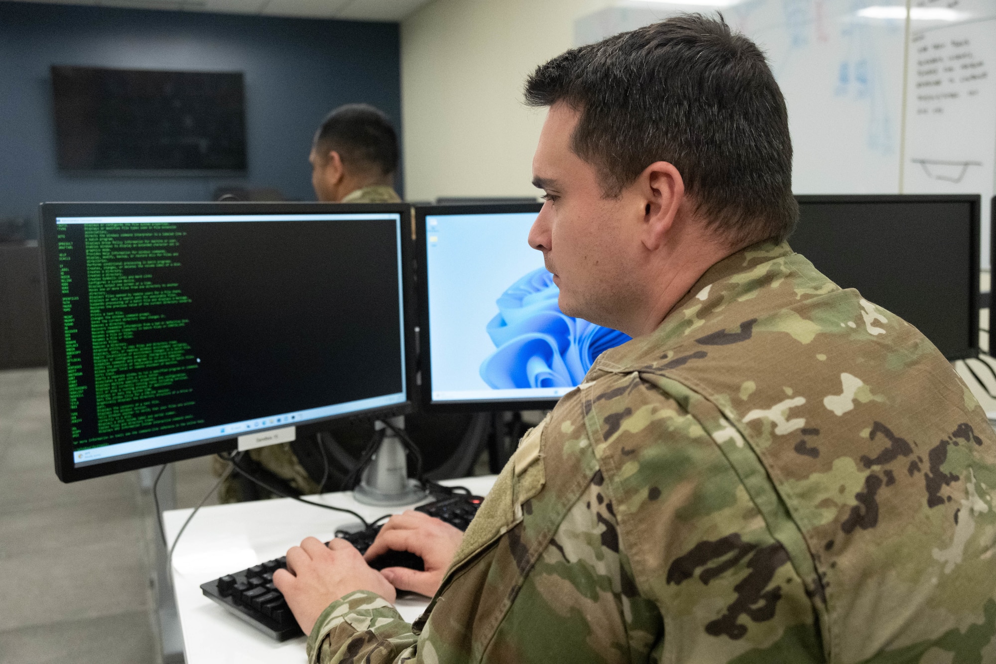 An Airmen assigned to the 275th Cyberspace Operations Squadron works at a computer terminal at Warfield Air National Guard Base at Martin State Airport, Middle River, Md., on January 10, 2023.