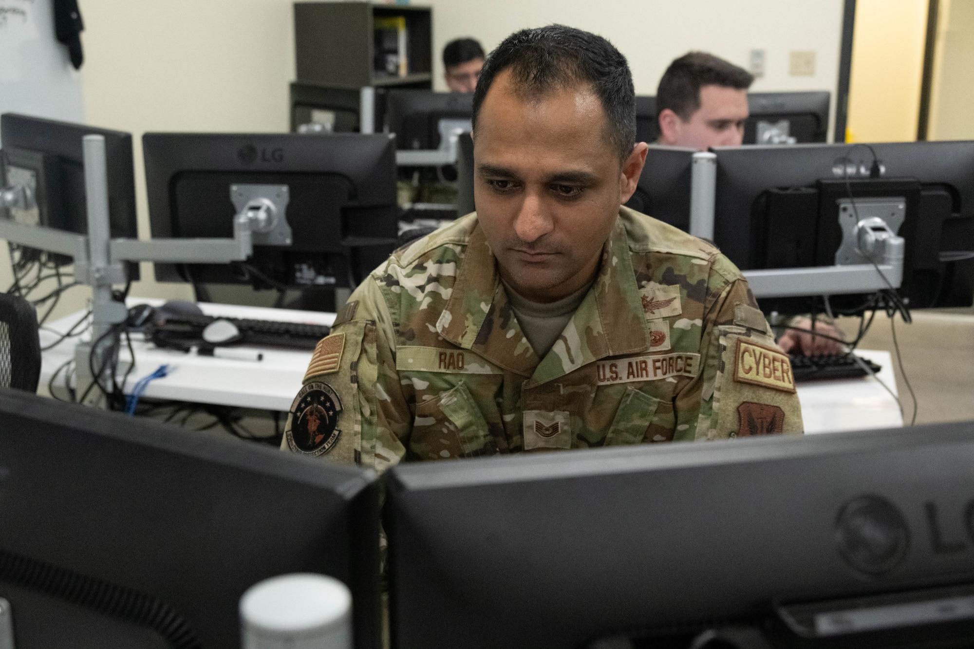 An Airmen assigned to the 275th Cyberspace Operations Squadron works at a computer terminal at Warfield Air National Guard Base at Martin State Airport, Middle River, Md., on January 10, 2023.