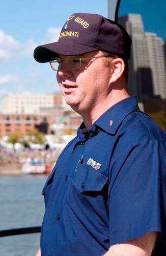 Lt. David Williams, a Coast Guard security operations officer, looks out onto the Ohio River in July 2003 during the Tall Stacks Festival in Cincinnati. The Coast Guard put five patrol boats on the river, keeping the waterways safe for vessel traffic and paddle wheelers in the festival. (Contributed photo)