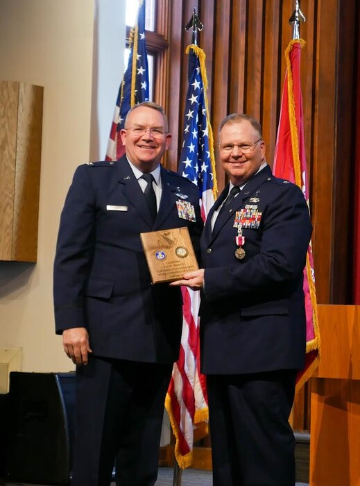 (Lt. Col.) David Williams (right) is honored during his retirement ceremony Nov. 4 with 88th Air Base Wing Chaplain (Col.) Kim Bowen. Williams was the longest-serving member of the 88 ABW Chaplain Office staff at Wright-Patterson Air Force Base. (Contributed photo)