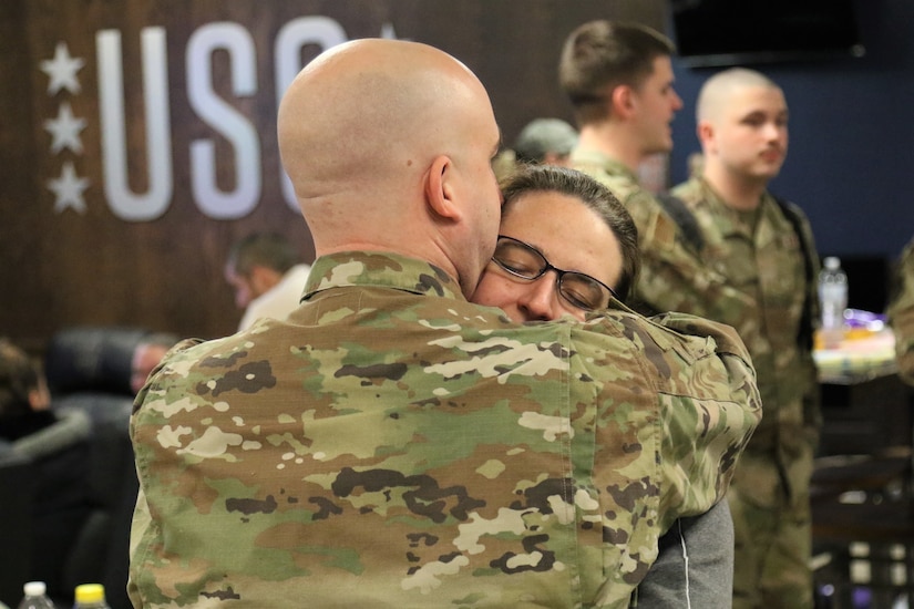 U.S. Airmen with the 211th Engineering Installation Squadron, 193rd Regional Support Group, 193rd Special Operations Wing spend time with and say goodbye to their loved ones during a farewell breakfast at the Liberty USO at Fort Indiantown Gap, Pa., Jan. 20, 2023, before leaving for deployment. The Airmen will serve in the U.S. Central Command area of operations for approximately six months.