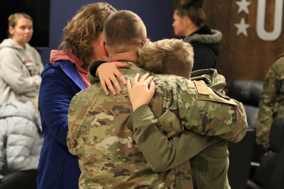 U.S. Airmen with the 211th Engineering Installation Squadron, 193rd Regional Support Group, 193rd Special Operations Wing spend time with and say goodbye to their loved ones during a farewell breakfast at the Liberty USO at Fort Indiantown Gap, Pa., Jan. 20, 2023, before leaving for deployment. The Airmen will serve in the U.S. Central Command area of operations for approximately six months.