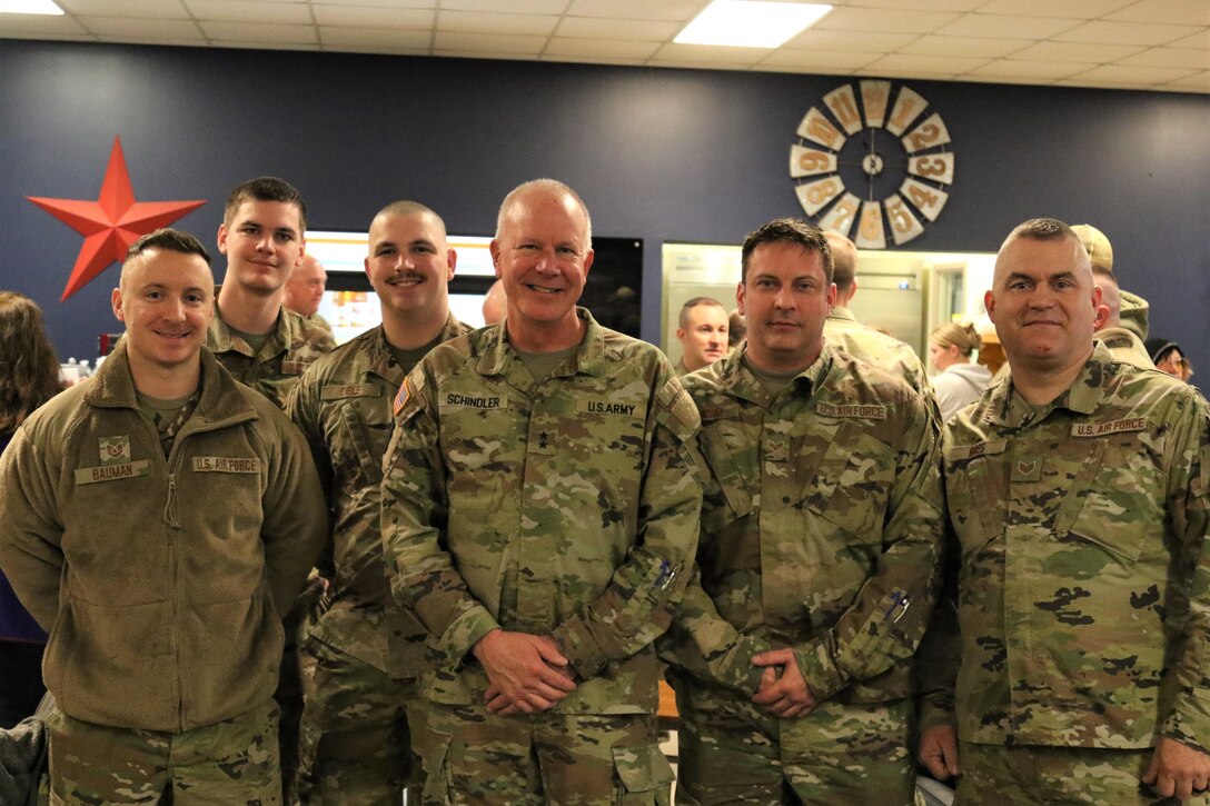 U.S. Airmen with the 211th Engineering Installation Squadron, 193rd Regional Support Group, 193rd Special Operations Wing spend time with and say goodbye to their loved ones during a farewell breakfast at the Liberty USO at Fort Indiantown Gap, Pa., Jan. 20, 2023, before leaving for deployment. The Airmen will serve in the U.S. Central Command area of operations for approximately six months.