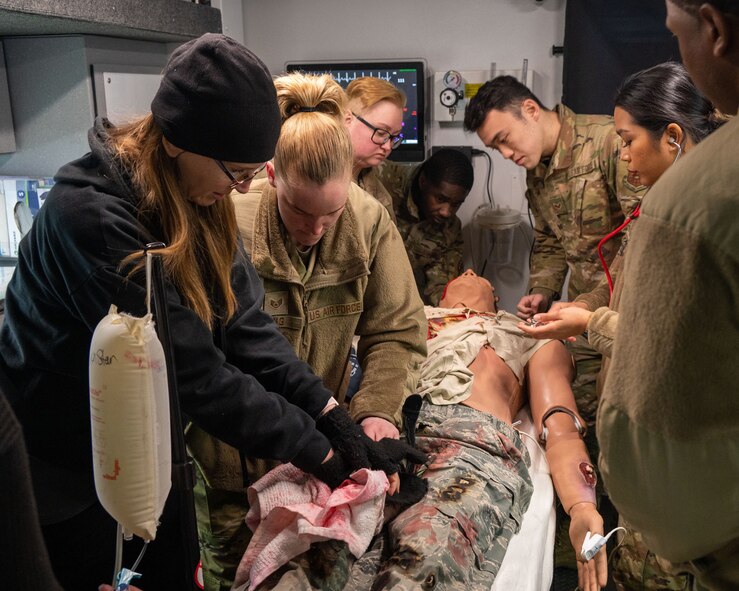 U.S. Air Force Maj. John Williams, 5th Medical Group (MDG) nurse, inserts endotracheal tubing into a simulated patient during a 5th MDG training day at Minot Air Force Base, North Dakota, Jan. 11, 2023. The endotracheal tubing is put in place in order to provide the patient with an artificial airway.