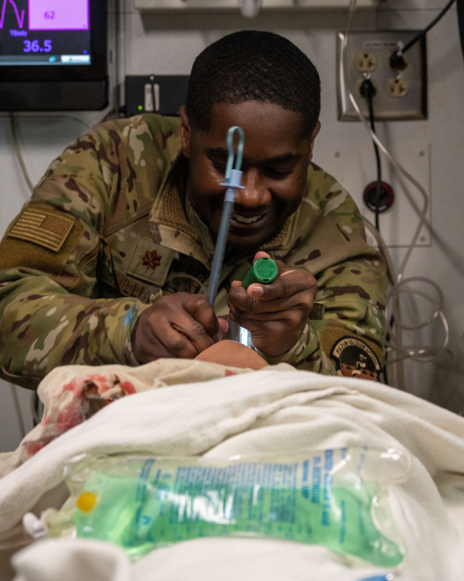 U.S. Air Force Maj. John Williams, 5th Medical Group (MDG) nurse, inserts endotracheal tubing into a simulated patient during a 5th MDG training day at Minot Air Force Base, North Dakota, Jan. 11, 2023. The endotracheal tubing is put in place in order to provide the patient with an artificial airway.