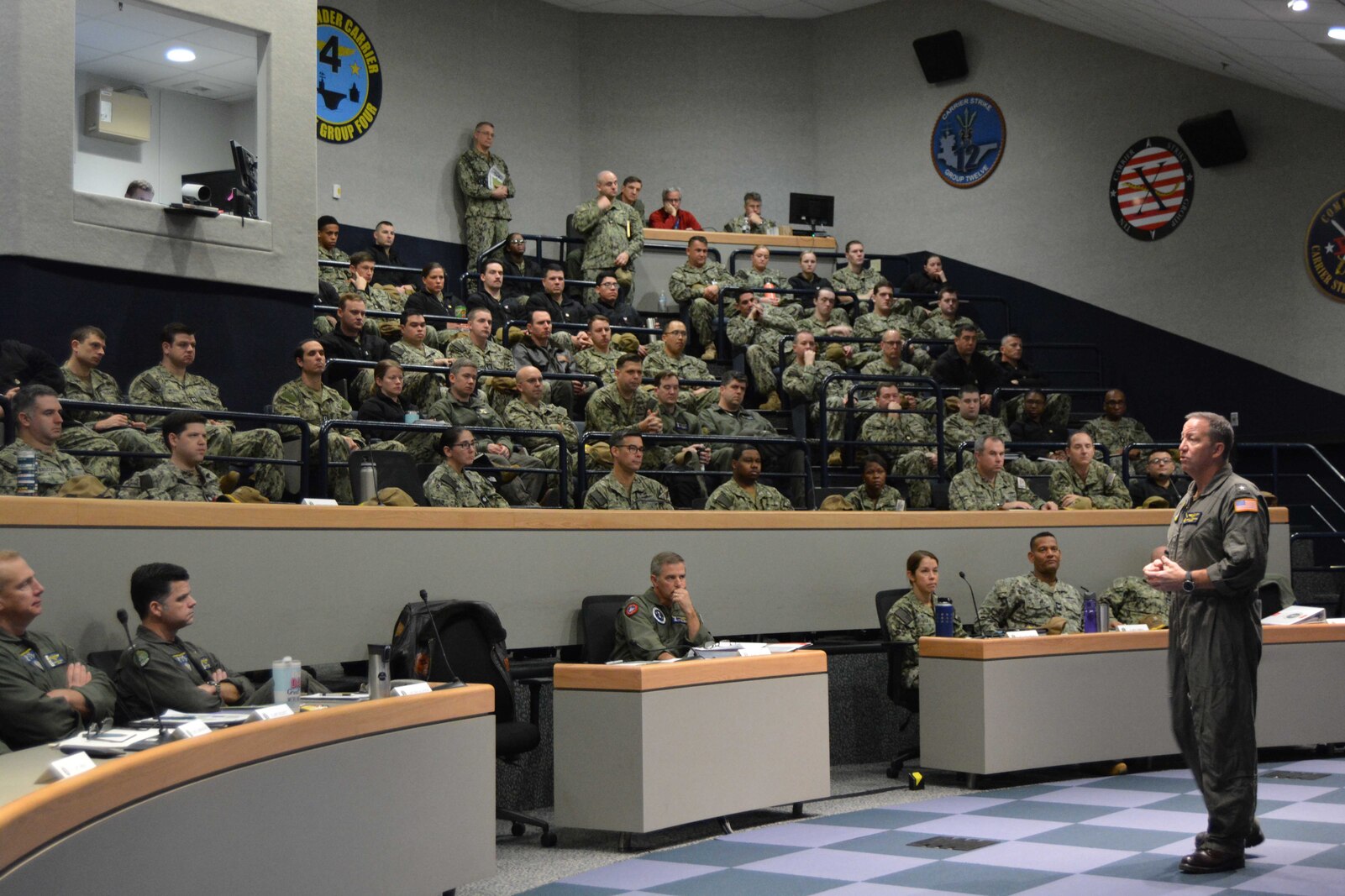 Rear Adm. Jeffrey “Caesar” Czerewko, commander, Carrier Strike Group (CSG) 4, provides welcoming remarks at a warfare commanders conference for CSG 2 leadership hosted by Tactical Training Group Atlantic.