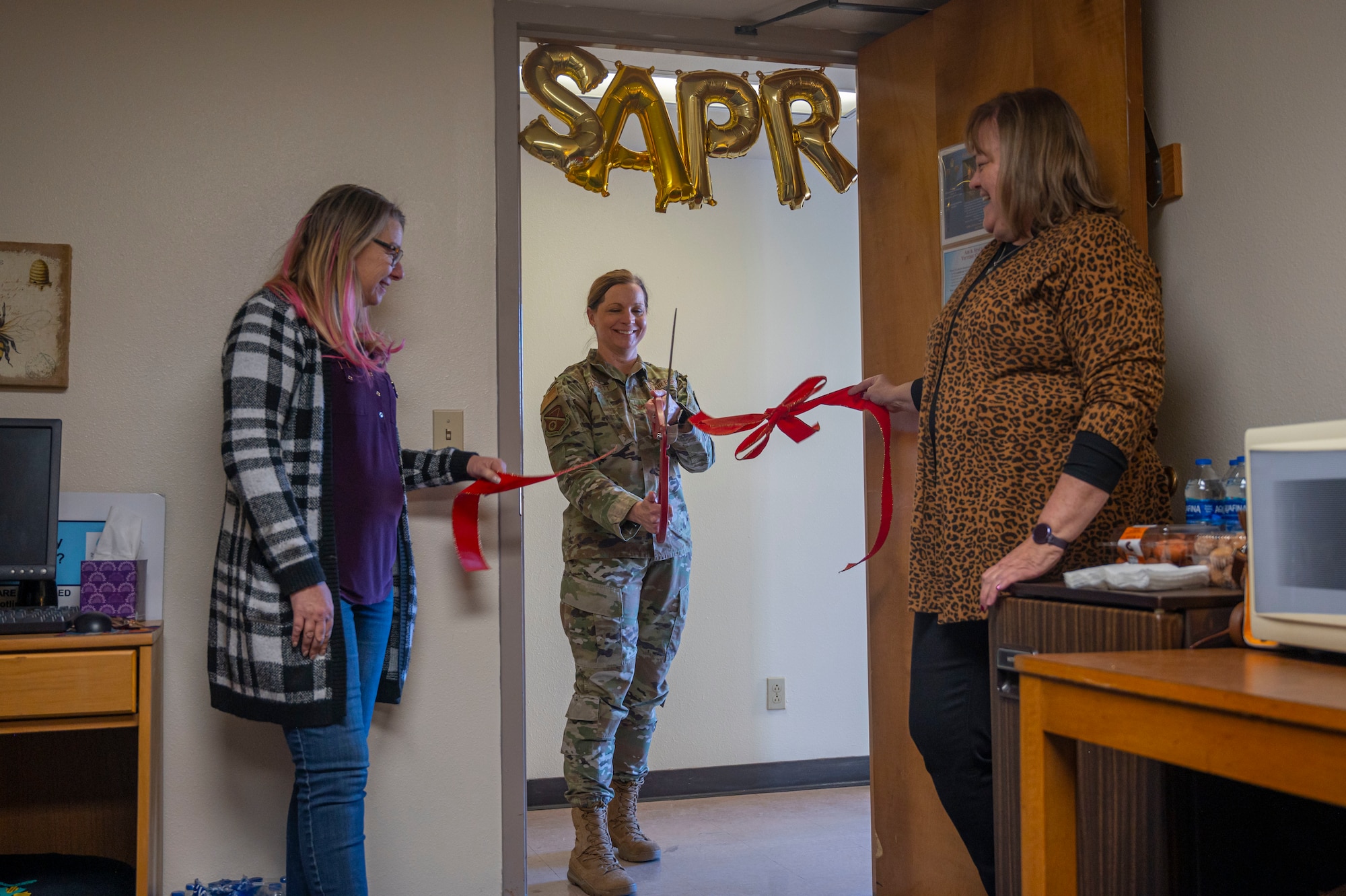 Col. Cornett cuts ribbon at SAPR satellite office opening.