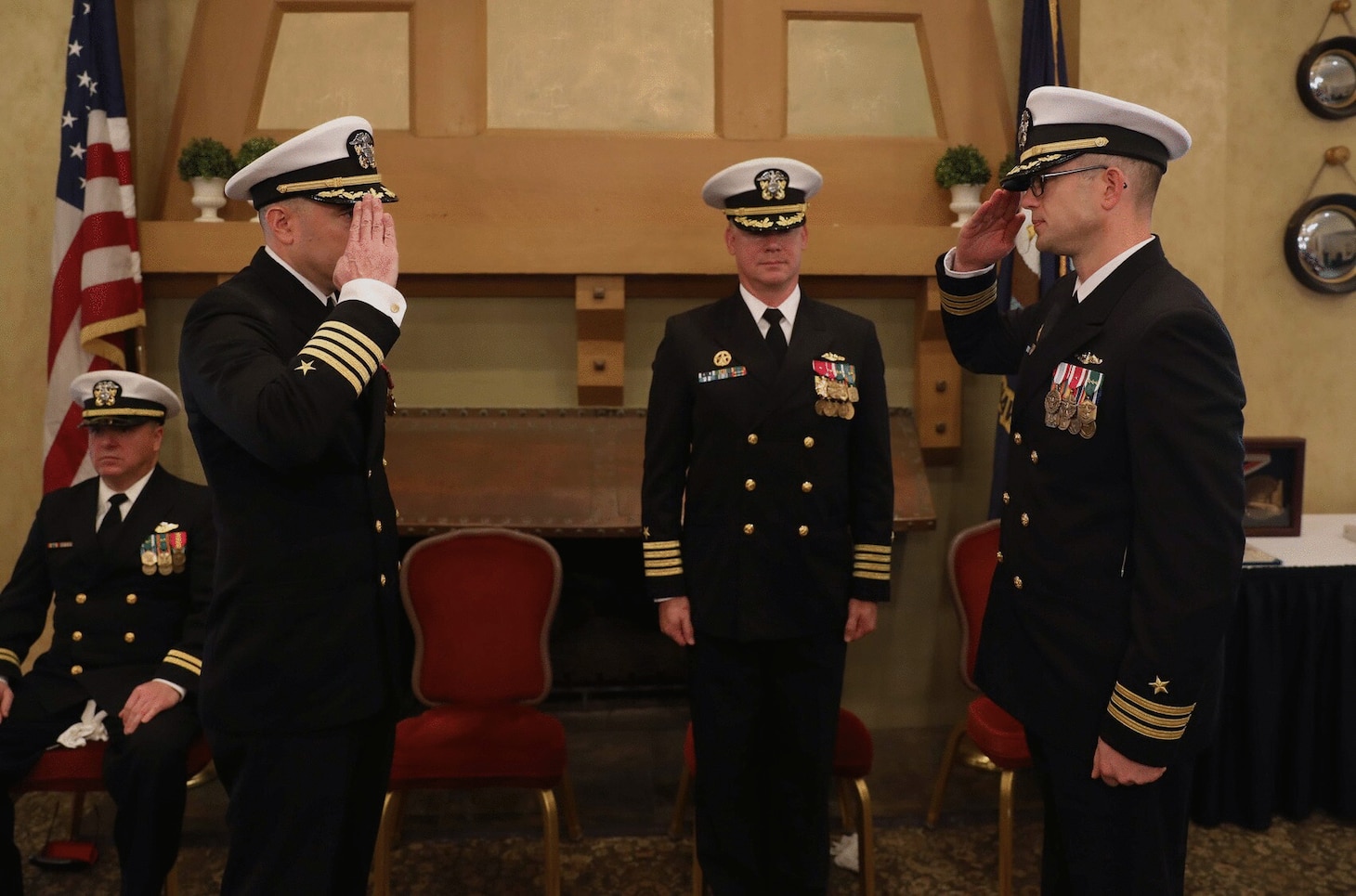 Capt. Bennett Christman, left, is relieved by Cmdr. Carl Jappert, right, during a change of command ceremony for the Virginia-class fast-attack submarine USS New Hampshire (SSN 778) onboard Naval Support Activity Hampton Roads, Jan. 20.