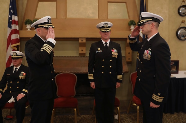 Capt. Bennett Christman, left, is relieved by Cmdr. Carl Jappert, right, during a change of command ceremony for the Virginia-class fast-attack submarine USS New Hampshire (SSN 778) onboard Naval Support Activity Hampton Roads, Jan. 20.
