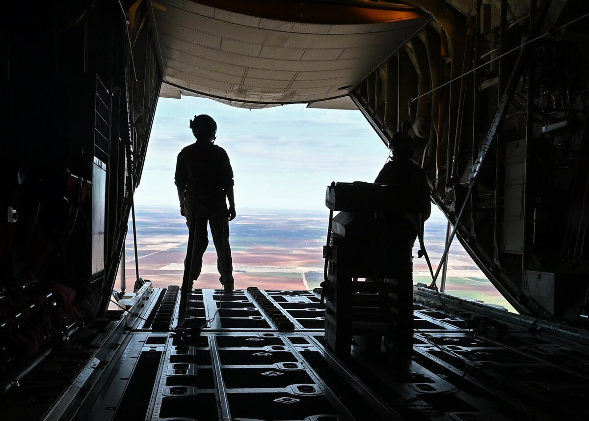U.S. Air Force Staff Sgt. Kirby Graves, 317th Operational Support Squadron loadmaster, stands at the C-130J Super Hercules cargo ramp during a flight, Dyess Air Force Base, Texas, Jan 20, 2023. Dyess AFB hosted a flight to showcase the mission of the 7th Bomb Wing and the 317th Airlift Wing. (U.S. Air Force photo by Airman 1st Class Zachary Heimbuch)