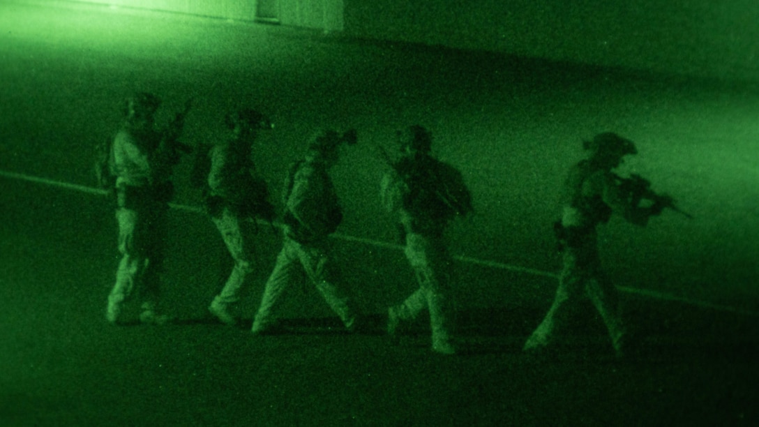 U.S. Marines with the 31st Marine Expeditionary Unit Maritime Raid Force patrol while conducting a simulated limited scale raid during the Realistic Urban Training Exercise 23.1 on Dillingham Airfield, Waialua, Hawaii, Jan. 13, 2023. The purpose of RUTEX is to incorporate the specialized individual and small unit skills of the MEU and conduct high-intensity, advanced, and complex Marine Air Ground Task Force operations in order to prepare MEUs and other designated forces to support the geographic combatant commanders. (U.S. Marine Corps photo by Cpl. Arianna Lindheimer)