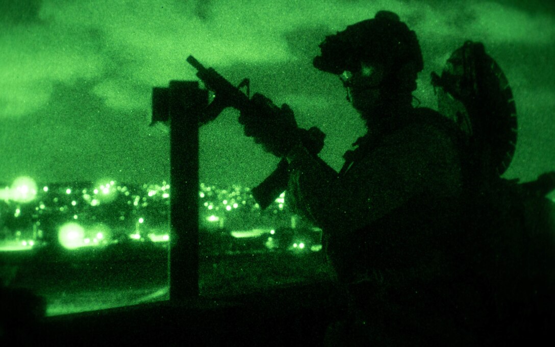 A U.S. Marine with the 31st Marine Expeditionary Unit Maritime Raid Force posts security while conducting a limited scale raid during the Realistic Urban Training Exercise 23.1 in Aloha Stadium, Aeia, Hawaii, Jan. 17, 2023. The purpose of RUTEX is to incorporate the specialized individual and small unit skills of the MEU and conduct high-intensity, advanced, and complex Marine Air Ground Task Force operations in order to prepare MEUs and other designated forces to support the geographic combatant commanders. (U.S. Marine Corps photo by Cpl. Arianna Lindheimer)