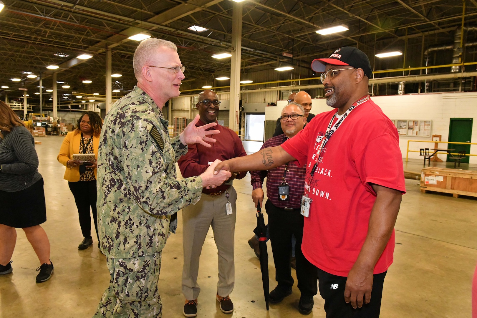 Photo shows two men shaking hands