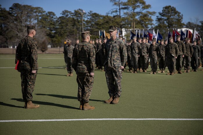 U.S. Marine Corps Sgt. Maj. Kyle R. Dubois, left, sergeant major, and Lt. Col. Robert D. Barbaree III, center, commanding officer, both with Headquarters and Headquarters Squadron (H&HS), Marine Corps Air Station (MCAS) New River, award the Bronze Star Medal to Master Sgt. Kevin Haunschild, right, a senior air traffic controller with H&HS, MCAS New River, on MCAS New River in Jacksonville, North Carolina, Jan. 20, 2023. Haunschild received the Bronze Star medal for his actions as Marine Air Traffic Control Mobile Team Leader with Marine Medium Tiltrotor Squadron-162 during Operation Freedom’s Sentinel. (U.S. Marine Corps photo by Cpl. Antonino Mazzamuto)