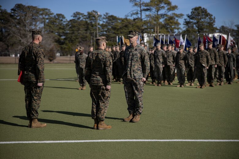 U.S. Marine Corps Sgt. Maj. Kyle R. Dubois, left, sergeant major, and Lt. Col. Robert D. Barbaree III, center, commanding officer, both with Headquarters and Headquarters Squadron (H&HS), Marine Corps Air Station (MCAS) New River, award the Bronze Star Medal to Master Sgt. Kevin Haunschild, right, a senior air traffic controller with H&HS, MCAS New River, on MCAS New River in Jacksonville, North Carolina, Jan. 20, 2023. Haunschild received the Bronze Star medal for his actions as Marine Air Traffic Control Mobile Team Leader with Marine Medium Tiltrotor Squadron-162 during Operation Freedom’s Sentinel. (U.S. Marine Corps photo by Cpl. Antonino Mazzamuto)