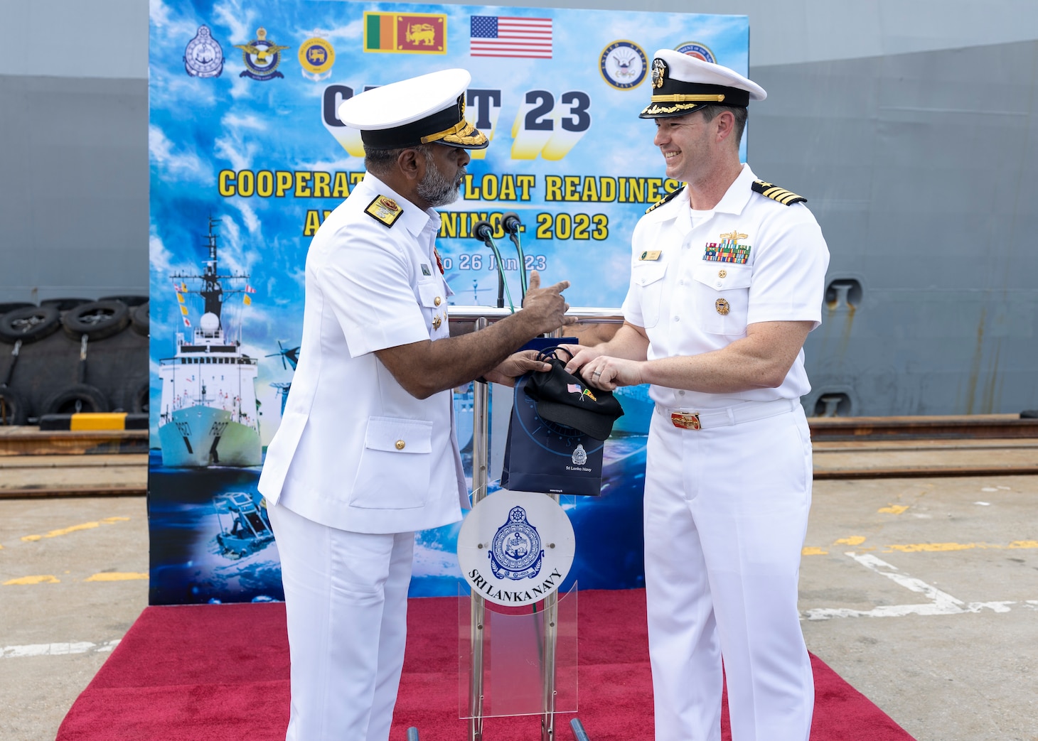 Rear Adm. Pradeep Rathnayake, deputy chief of staff and director general operations, Sri Lankan Navy, exchanges gifts with U.S. Navy Capt. Sean Lewis, deputy commodore, Destroyer Squadron 7, for Cooperation Afloat Readiness and Training/Marine Exercise Sri Lanka 2023 in Colombo, Jan. 19. CARAT/MAREX Sri Lanka is a bilateral exercise between Sri Lanka and the United States designed to promote regional security cooperation, practice humanitarian assistance and disaster relief, and strengthen maritime understanding, partnerships, and interoperability. In its 28th year, the CARAT series is comprised of multinational exercises, designed to enhance U.S. and partner forces’ abilities to operate together in response to traditional and non-traditional maritime security challenges in the Indo-Pacific region.