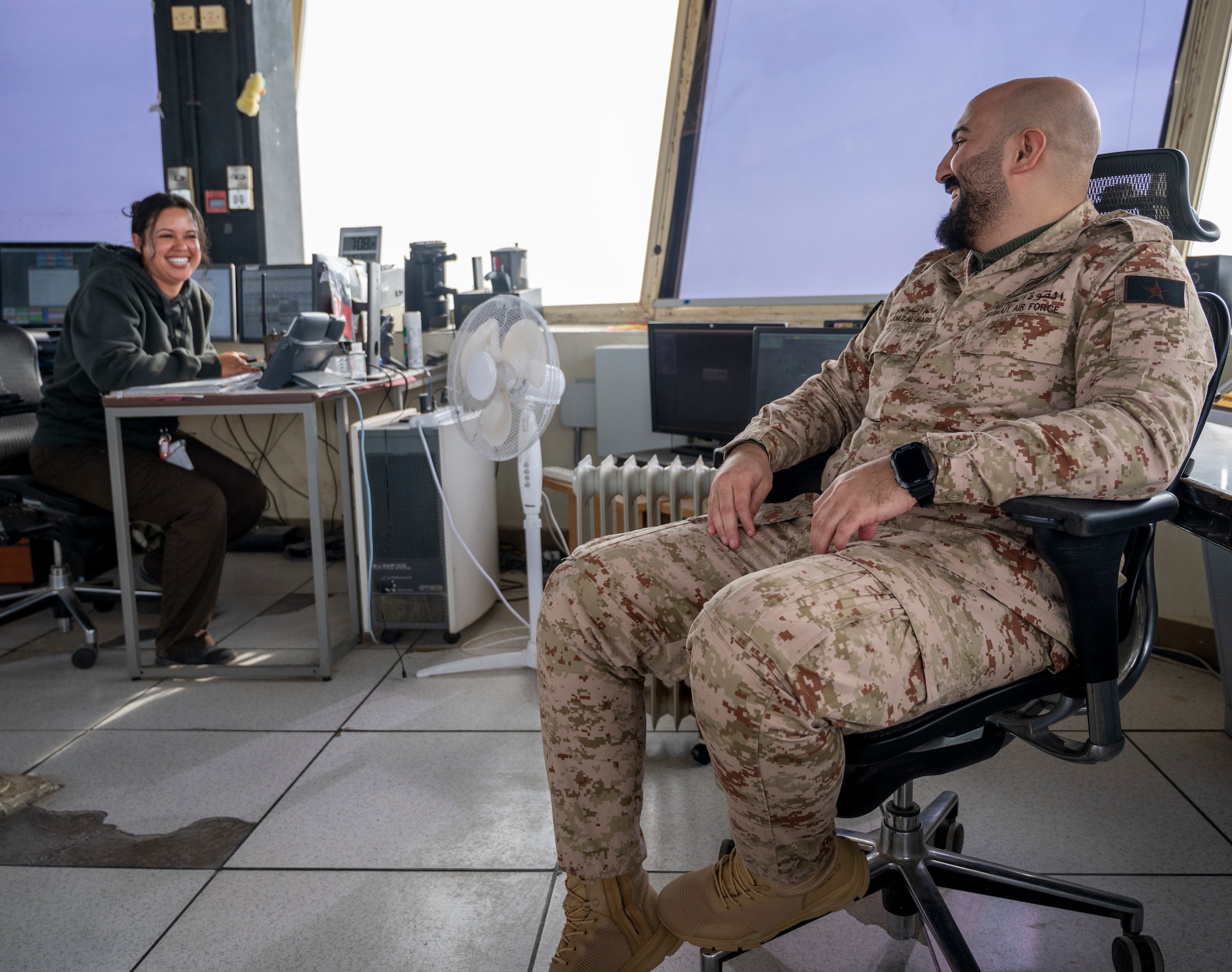 Ms. Allison Neilsen (left), an air traffic training manager with the 407th Expeditionary Operations Support Squadron, speaks with Kuwait Air Force First Sergeant Salem Al-Harib (Right), senior air traffic controller, at Ali Al Salem Air Base, Kuwait, Jan. 16, 2023.