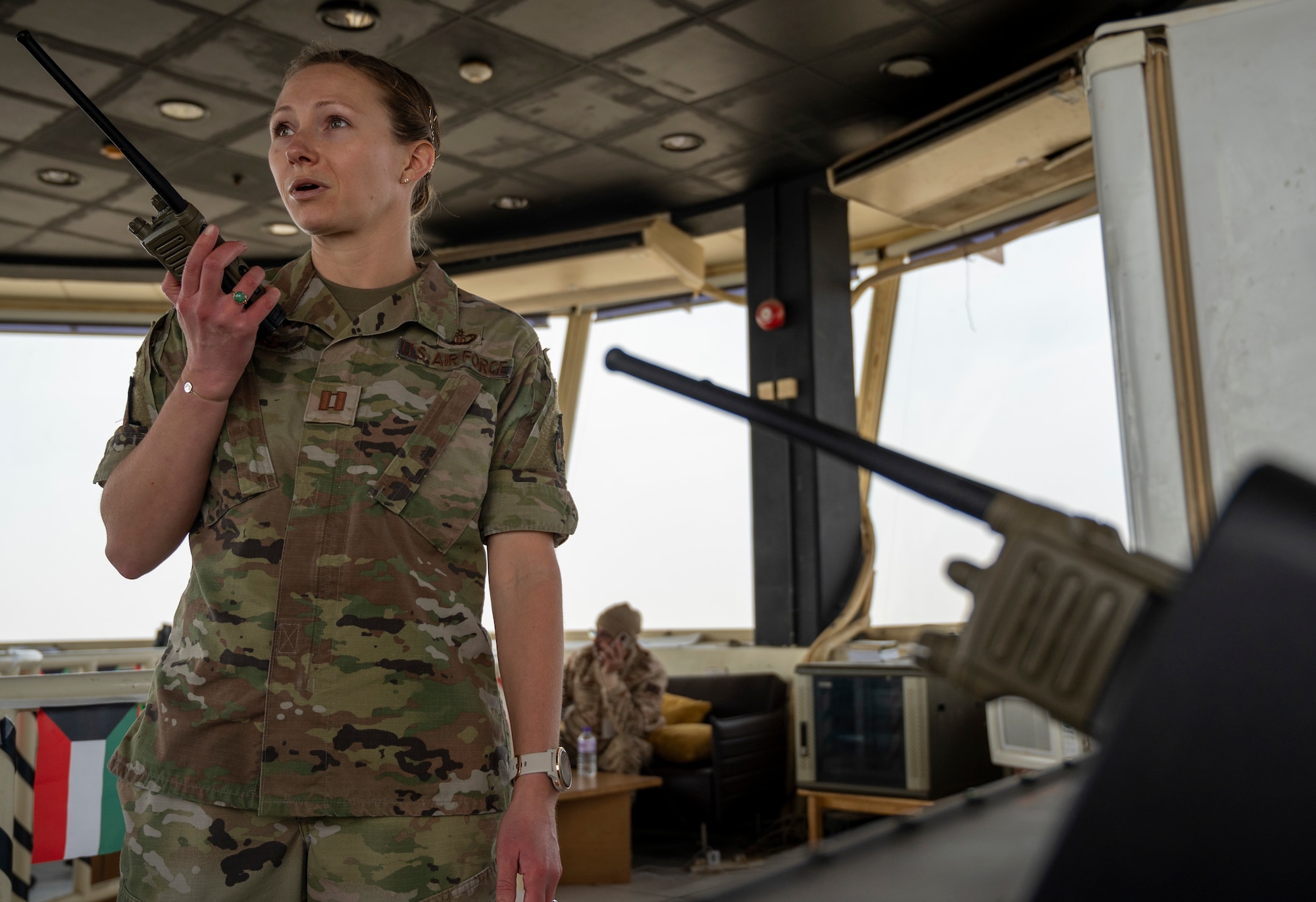 U.S. Air Force Capt. Sam Jones, 407th Expeditionary Operations Support Squadron airfield operations flight commander, speaks into a radio at Ali Al Salem Air Base, Kuwait, Jan. 16, 2023.