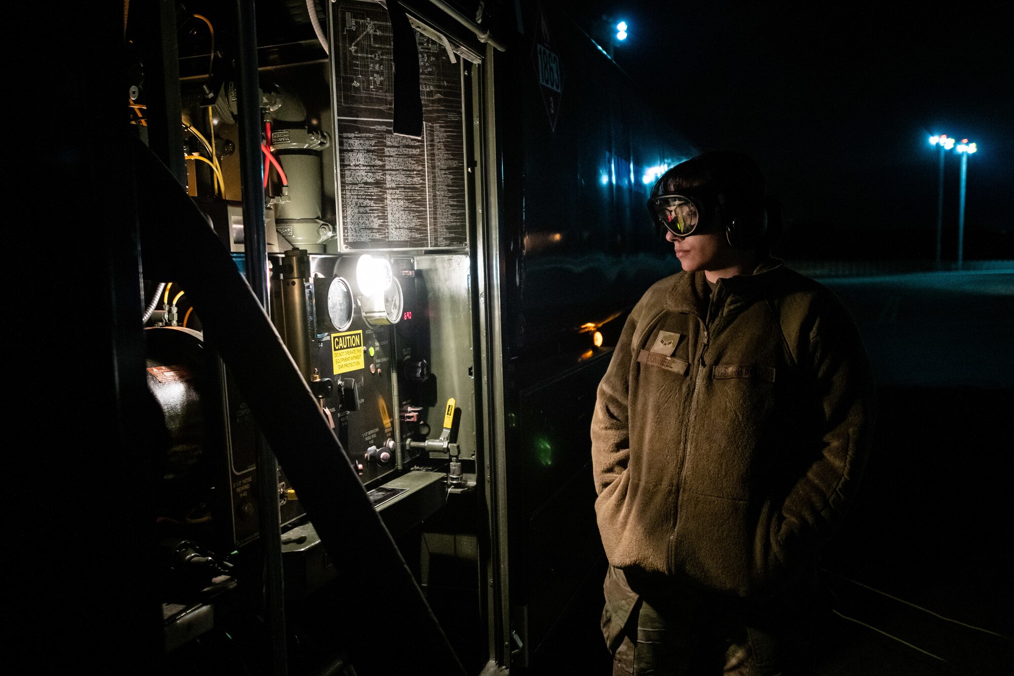 Airman checks fuel gauges.