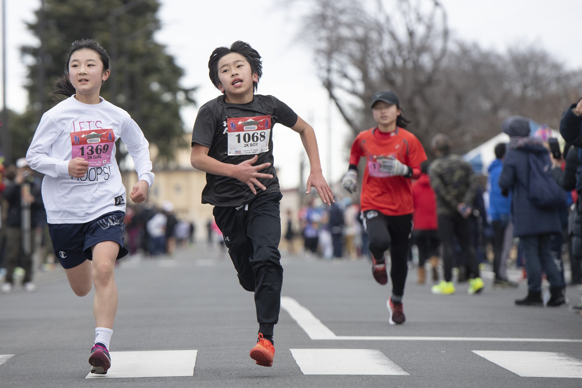 Children race toward the finish line during the 42nd annual Frostbite Road Race.