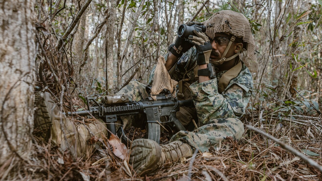 U.S. Marine Corps Staff Sgt. Favio Cuero, a Middletown, New York, native and an explosive ordnance disposal technician with Combat Logistics Battalion 24, 2nd Marine Division, conducts reconnaissance during a scout course on Camp Lejeune, North Carolina, Jan. 19, 2023. The purpose of the scout course is to enhance lethality and increase long range weapon proficiency.