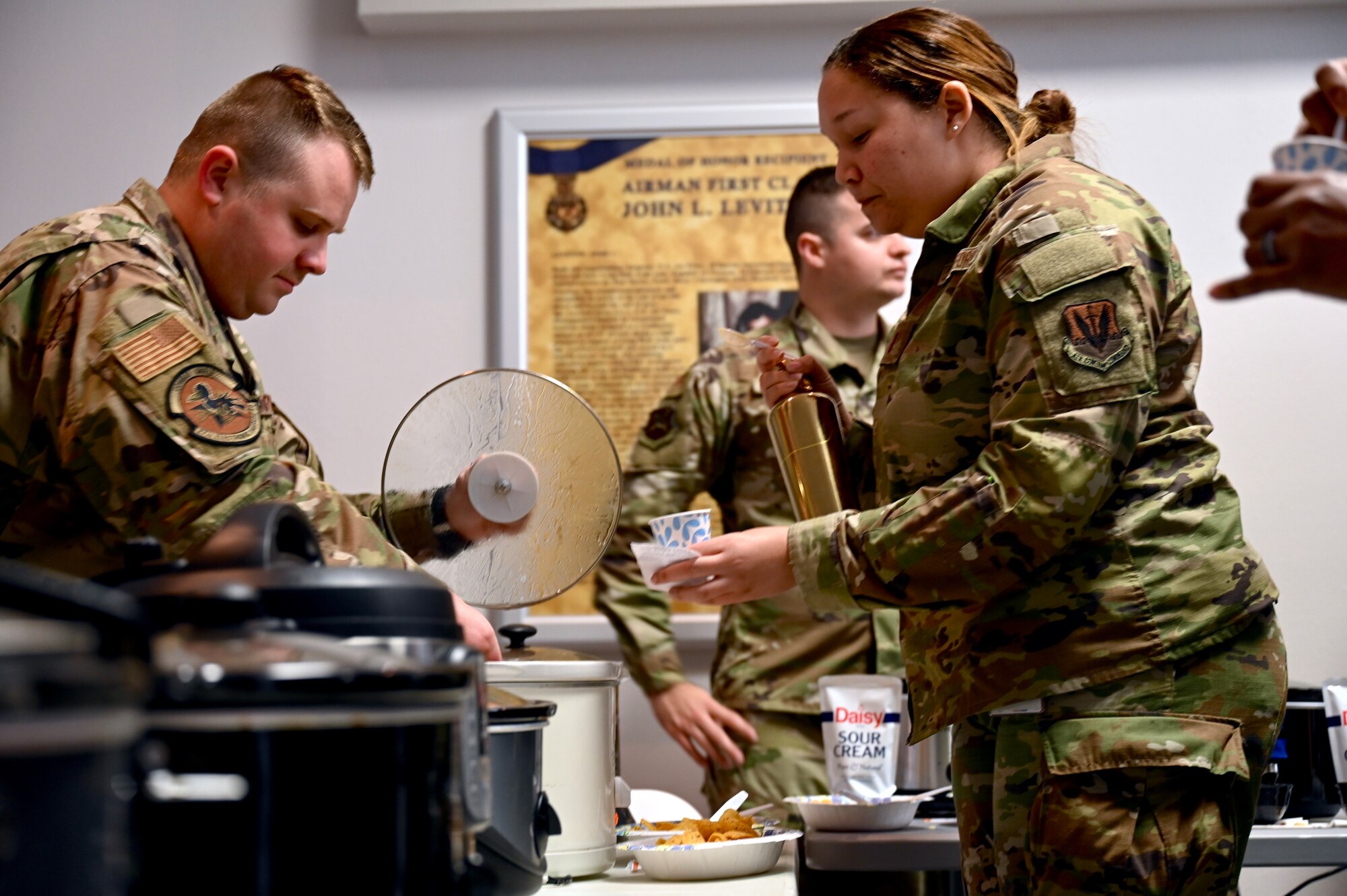 Airmen from the 350th Spectrum Warfare Wing participate in the wing’s first annual Chili Cook Off Competition at Eglin Air Force, Fla., Jan. 17, 2023. More than fifteen chilis were cooked and presented for judging during the competition by Airmen across the wing. (U.S. Air Force photo by 1st Lt. Benjamin Aronson)