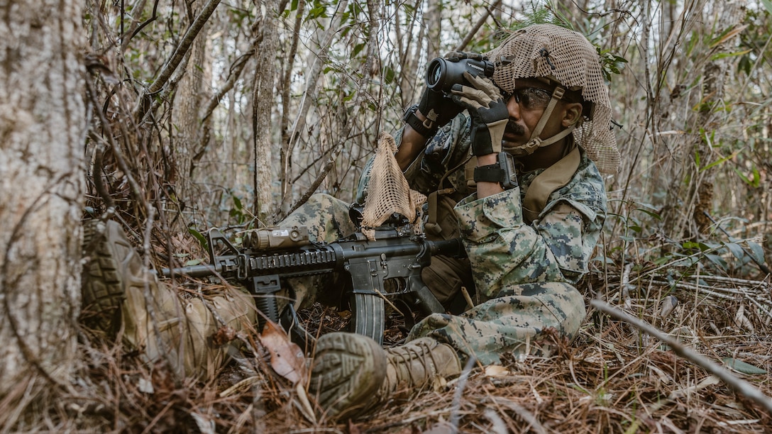 U.S. Marine Corps Staff Sgt. Favio Cuero, a Middletown, New York, native and an explosive ordnance disposal technician with Combat Logistics Battalion 24, 2nd Marine Division, conducts reconnaissance during a scout course on Camp Lejeune, North Carolina, Jan. 19, 2023. The purpose of the scout course is to enhance lethality and increase long range weapon proficiency.