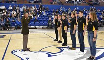 Lt. Gen. Daniel L. Karbler, commanding general, U.S. Army Space and Missile Defense Command, administers the oath of enlistment to six future Army Soldiers during the University of Alabama in Huntsville’s Military Appreciation Night at the Chargers basketball game, Jan. 21. (U.S. Army photo by Lira Frye)