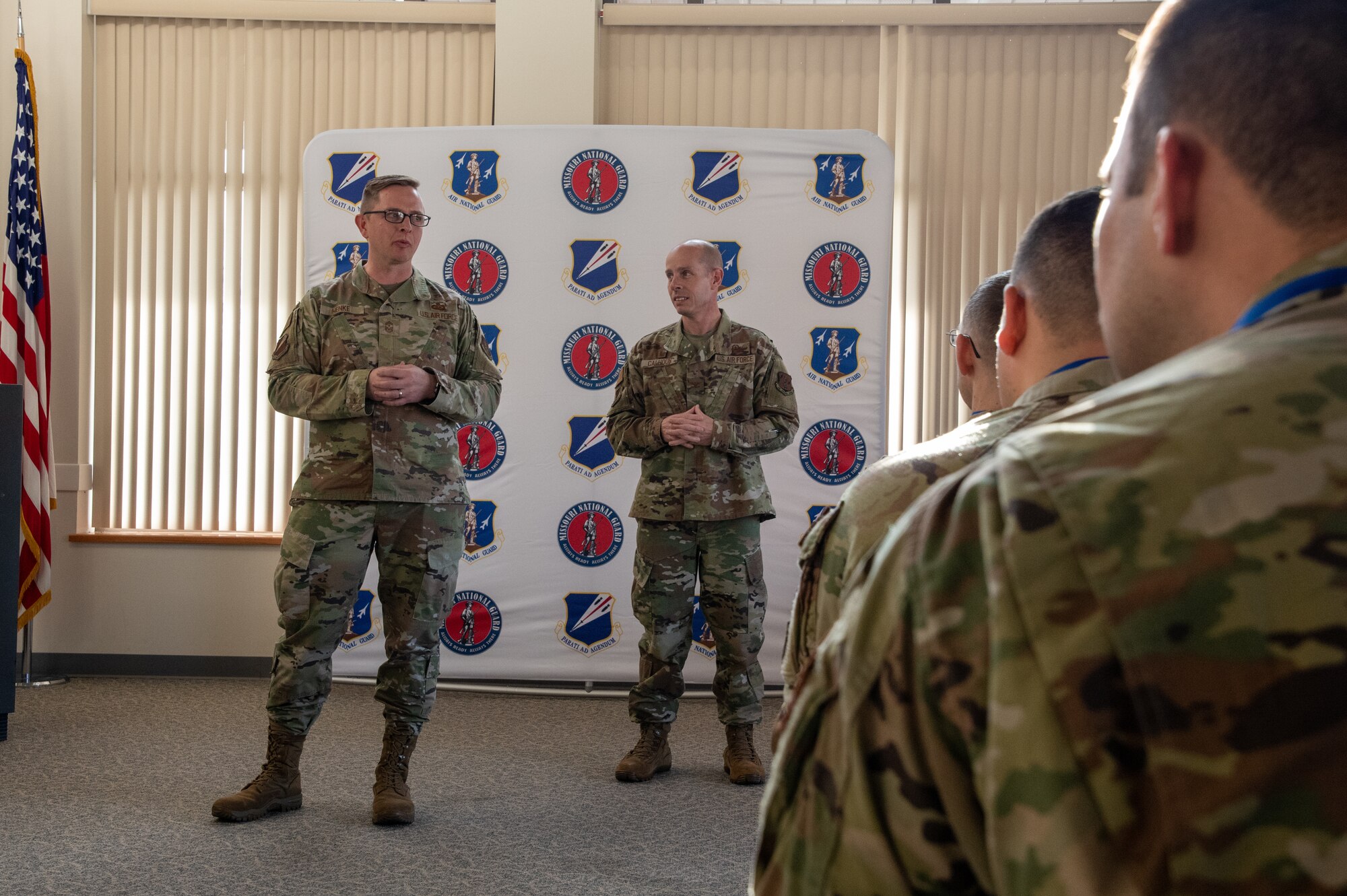 Chief Master Sgt. Jason Henke, 131st Bomb Wing command chief master sergeant, inspires inductees during a senior noncommissioned officer induction ceremony at Knob Noster, Missouri, Jan. 8, 2023. Henke emphasized the critical role SNCOs play in ensuring Air Force mission success. (U.S. Air National Guard photo by Airman 1st Class Phoenix Lietch)