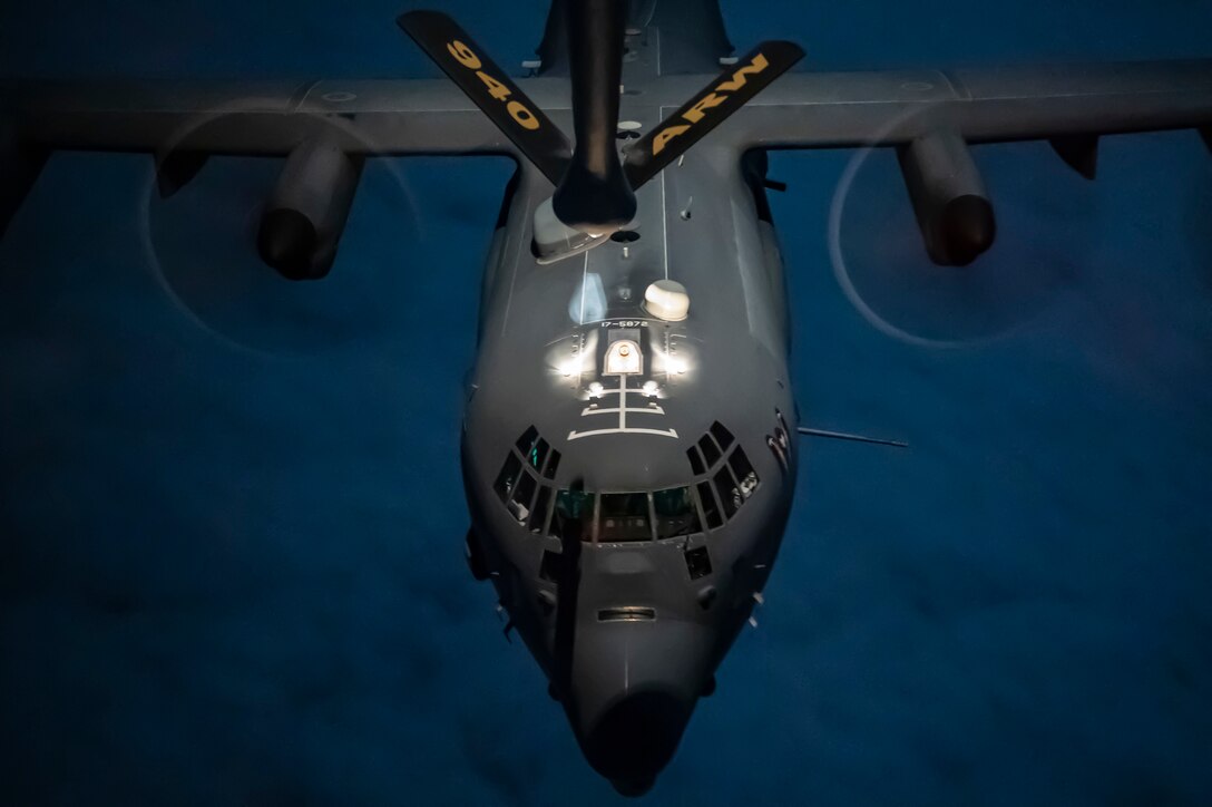 A U.S. Air Force AC-130J Ghostrider approaches a KC-135 Stratotanker assigned to the 91st Expeditionary Air Refueling Squadron within the U.S. Central Command area of responsibility, Dec. 30, 2022. The 91st EARS delivers fuel for U.S. and partner nation forces, extending the reach and combat airpower to the region. (U.S. Air Force photo by Tech. Sgt. Daniel Asselta)