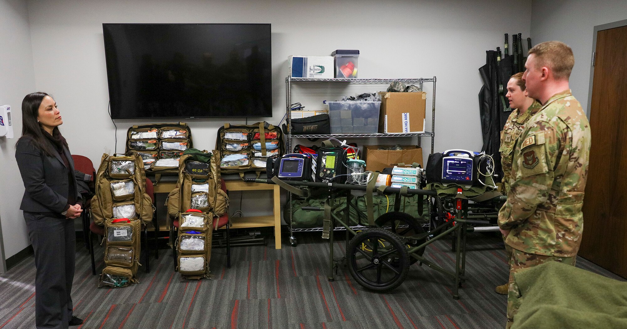 Capt. Nathaniel Copen, 445th Aeromedical Evacuation Squadron director of operations, and Tech. Sgt. Marjorie Butcher, 445th AES AE technician, show the Honorable Gina Ortiz Jones, Under Secretary of the Air Force, some of the equipment the squadron uses and what their squadron’s role in the wing is during her visit to Wright-Patterson Air Force Base, Ohio Jan. 9, 2023.