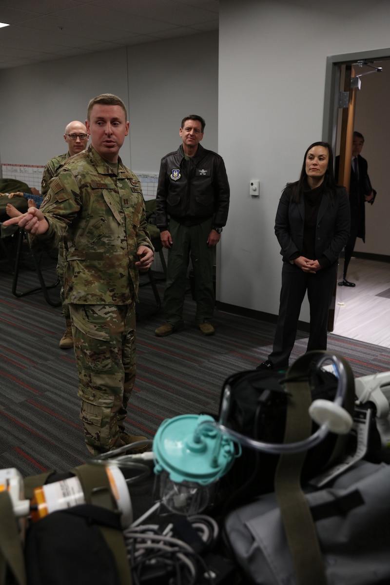 Capt. Nathaniel Copen, 445th Aeromedical Evacuation Squadron director of operations, shows the Honorable Gina Ortiz Jones, Under Secretary of the Air Force, some of the equipment the squadron uses and what their squadron’s role is in the wing during her visit to Wright-Patterson Air Force Base, Ohio Jan. 9, 2023.