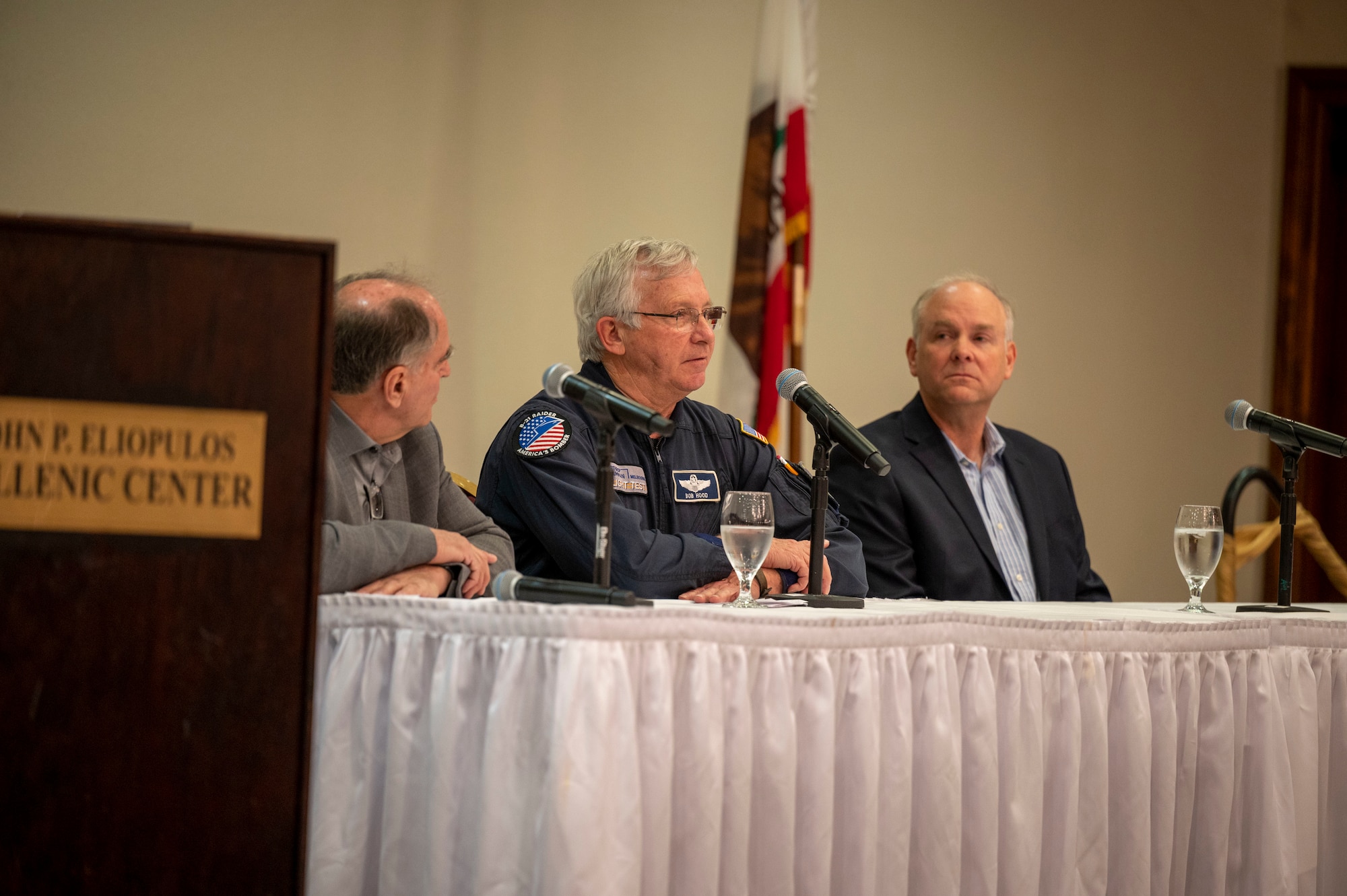 The First Flight Consideration Panel speaks at the First Flights in the Antelope Valley dinner. (Panel: Dan Canin, Experimental Test Pilot, Lockheed Martin, Bob Hood, Retired Colonel USAF and test pilot at Northrop Grumman and Evan Thomas, Director of Flight Operations for Stratolaunch, LLC.)