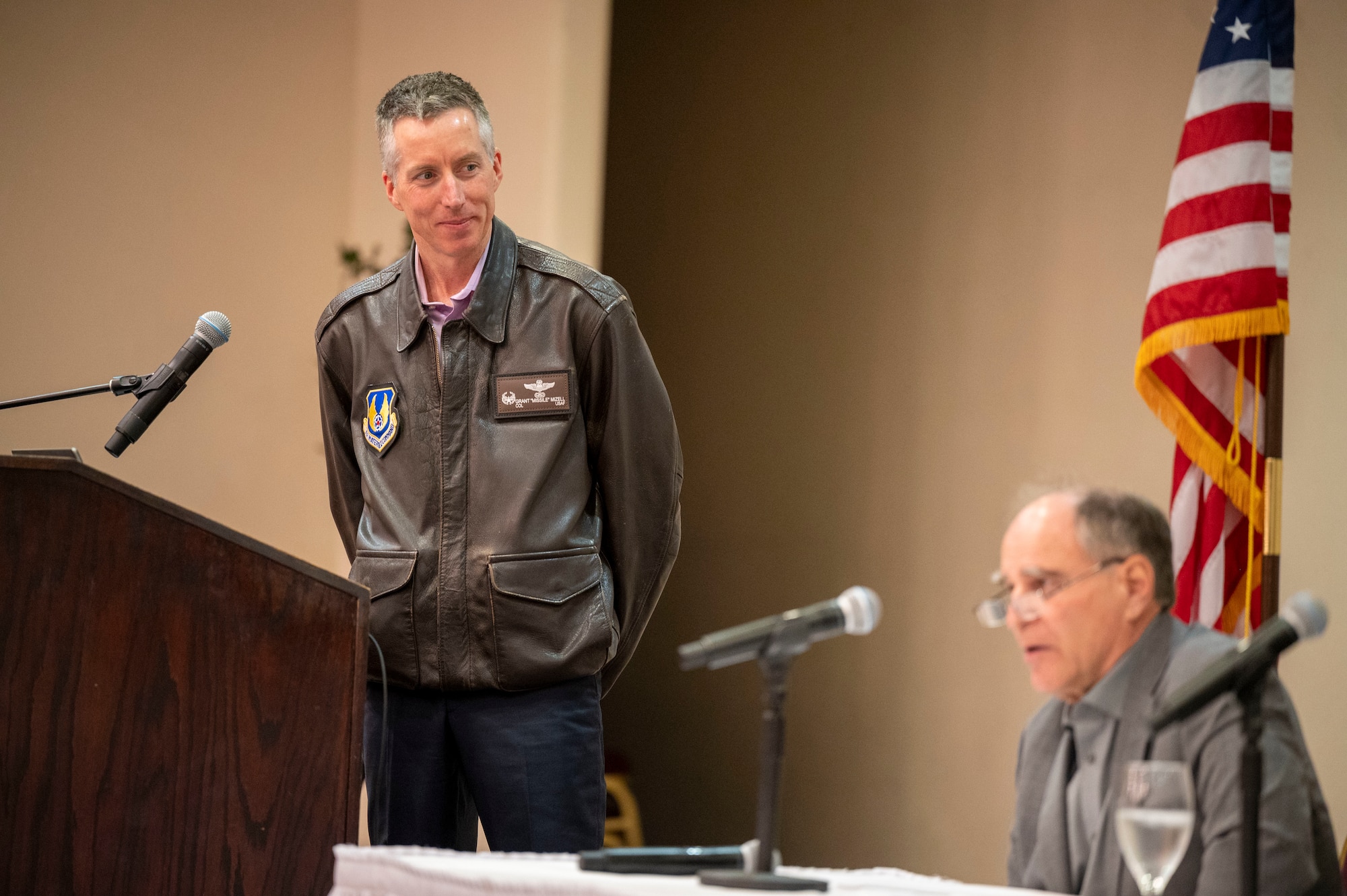 Col. Grant Mizell, Commander, 412th Operations Group moderates the First Flight Consideration Panel. (Panel: Dan Canin, Experimental Test Pilot, Lockheed Martin, Bob Hood, Retired Colonel USAF and test pilot at Northrop Grumman and Evan Thomas, Director of Flight Operations for Stratolaunch, LLC.)