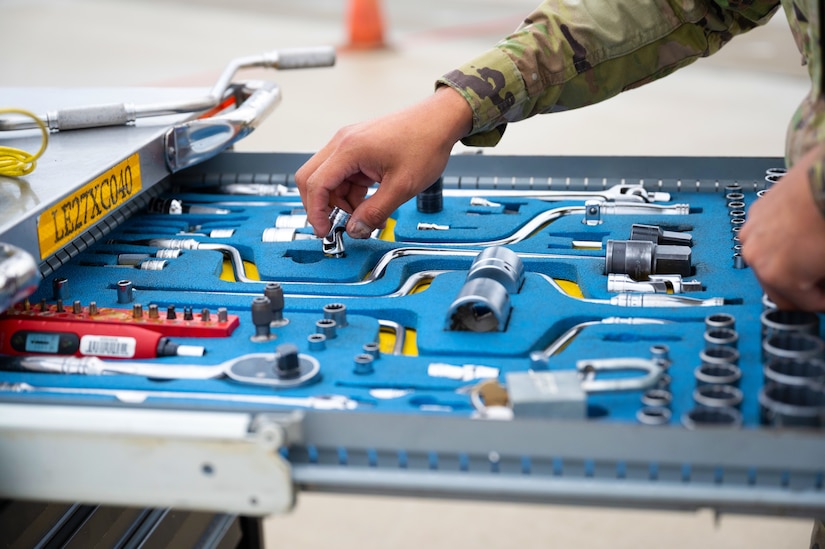 Airman prepares tools for use.
