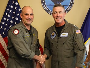 PENSACOLA, Fla. (Jan. 20, 2023) Rear Adm. Pete Garvin, commander, Naval Education and Training Command (NETC), right, greets Rear Adm. Brad Dunham, commander, Naval Air Force Reserve, left, during Dunham’s visit to NETC headquarters.  Dunham visited to discuss reserve enlisted naval aviation training. (U.S. Navy photo by Wade Buffington)