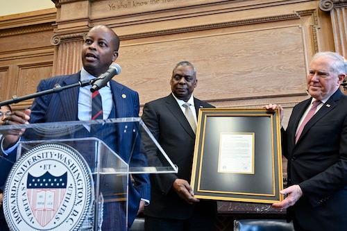 Howard University President Dr. Wayne Frederick, left, Secretary of Defense Lloyd Austin and Secretary of the Air Force Frank Kendall hold a proclamation announcing the partnership of Howard University as an Air Force university affiliated research center during a ceremony at the university in Washington, D.C., Jan. 23, 2023.  (U.S. Air Force photo by Eric Dietrich)